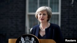 FILE - British Prime Minister Theresa May speaks to reporters outside No. 10 Downing Street in London, July 13, 2016.