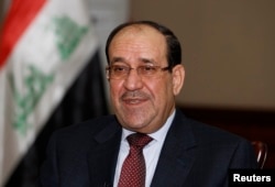Nuri al-Maliki speaks during an interview with Reuters in Baghdad, Jan. 12, 2014.