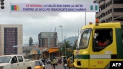 FILE - A banner reads 'Nigeria - an ally in the fight against terrrorist group Boko Haram' in Yaounde, Cameroon, July 28, 2015.