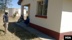 Some of the occupants seen outside a raided private house in Manicaland province.