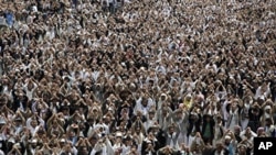 Anti-government protesters gesture during a demonstration demanding the resignation of Yemen's President Ali Abdullah Saleh, in Sanaa, Aug. 12, 2011