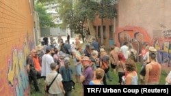 Members of Urban Coup tour the site of their planned co-housing project in Melbourne, Australia.