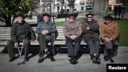 Retirees enjoy the sunshine in Bermeo, Spain, March 6, 2015. National Statistics Institute data indicate that if trends continue, Spain's percentage of the population over 65 will rise from today's 18.2 percent to 38.7 percent in 2064.