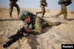 Saleh Khalil, 20, an Israeli Arab soldier from the Desert Reconnaissance battalion takes part in a drill near Kissufim in southern Israel, Nov. 29, 2016.