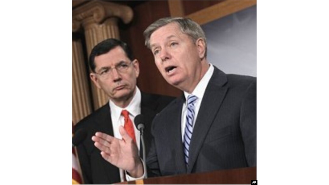 Sen. Lindsey Graham, R-S.C., right, and Sen. John Barrasso, R-Wyo. take part in a news conference,on Capitol Hill in Washington, February 02, 2011.