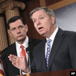Sen. Lindsey Graham, R-S.C., right, and Sen. John Barrasso, R-Wyo. take part in a news conference,on Capitol Hill in Washington, February 02, 2011.