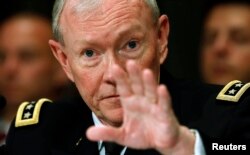 U.S. Chairman of the Joint Chiefs of Staff Gen. Martin Dempsey testifies at a Senate hearing on Capitol Hill in Washington Jun. 11, 2013.