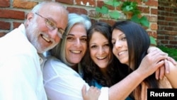 U.S. aid contractor Alan Gross and his wife Judy (2nd L) pose with their daughters in this undated family photograph released on October 23, 2010.