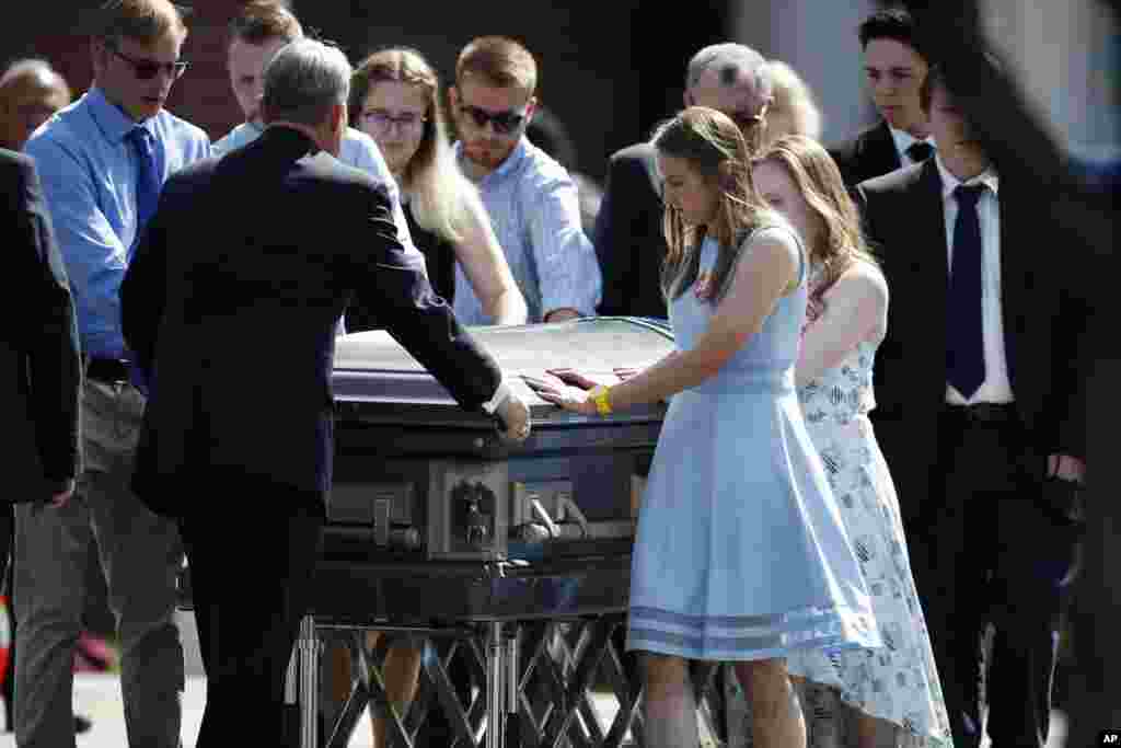 People carry a casket holding the body of Kendrick Castillo, a student who was killed in a gun attack last week at the STEM Highlands Ranch School, May 15, 2019, in Highlands Ranch, Colorado.
