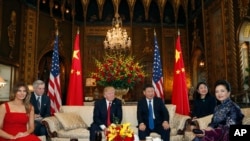 President Donald Trump and Chinese President Xi Jinping, sit with their wives, first lady Melania Trump, left, and Chinese first lady Peng Liyuan, right, before a meeting at Mar-a-Lago, Thursday, April 6, 2017, in Palm Beach, Fla. (AP Photo)