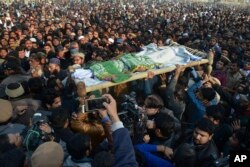 People attend a funeral of Zainab Ansari in Kasur, Jan. 10, 2018.