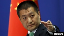 FILE - Chinese Foreign Ministry spokesman Lu Kang at a news conference in Beijing, Oct. 27, 2015. 
