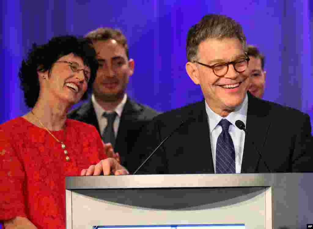 In Minnesota, Democratic incumbent Al Franken greets supporters after beating Republican Mike McFadden. Franken appears with wife Franni, left, and other relatives in Minneapolis, Nov. 4, 2014.