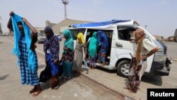 FILE - Ethiopian migrants are evacuated to the Red Sea port of Hodeida to board a ship to leave Yemen, June 2, 2018. 