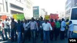 MDC-T youths clash with police in Harare over alleged abduction of one of Zimbabwe's public protest leaders. (Photo By Thomas Chiripasi)