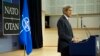 U.S. Secretary of State John Kerry addresses the international press corps during a news conference that followed a NATO Ministerial meeting in Brussels, Belgium, on December 3, 2013.