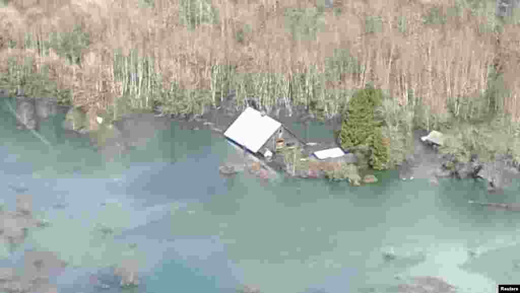 An aerial view of the area affected by a landslide near State Route 530 is seen in this photo provided by Governor Jay Inslee&#39;s office taken near Oso, Washington March 23, 2014.