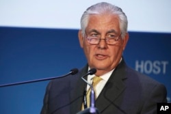 FILE - ExxonMobil CEO and Secretary of State-designate Rex Tillerson gives a speech at the annual Abu Dhabi International Petroleum Exhibition & Conference in Abu Dhabi, United Arab Emirates, Nov. 7, 2016.