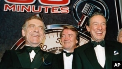 In this Nov. 10, 1993 file photo, The "60 Minutes" team, from left, Morley Safer, Steve Kroft and Mike Wallace pose at the Metropolitan Museum of Art in New York.