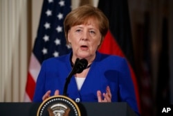 German Chancellor Angela Merkel speaks during a news conference with President Donald Trump in the East Room of the White House, April 27, 2018, in Washington.