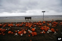 Pumpkins are strewn along the Gulf of Mexico in Pass Christian, Miss., in the aftermath of Hurricane Nate, Oct. 8, 2017.