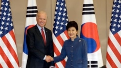 South Korean President Park Geun-hye, right, shakes hands with U.S. Vice President Joe Biden before their meeting at the presidential Blue House in Seoul, South Korea, Friday, Dec. 6, 2013.