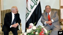 A handout picture from the Iraqi Presidency shows Iraqi President Jalal Talabani (R) meeting with US Defense Secretary Robert Gates in Baghdad, 10 Dec 2009