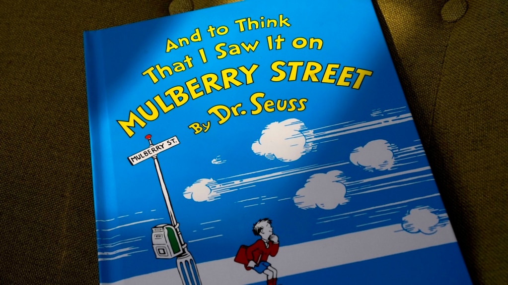 FILE - A copy of the book "And to Think That I Saw It on Mulberry Street," by Dr. Seuss, rests in a chair, Monday, March 1, 2021, in Walpole, Mass. (AP Photo/Steven Senne)