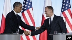 President Barack Obama and Poland's Prime Minister Donald Tusk shake hands during a joint news conference at the Chancellery Building in Warsaw, Poland, May 28, 2011