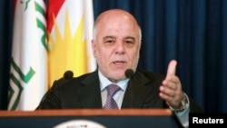 FILE - Iraqi Prime Minister Haider al-Abadi addresses the media during a news conference.
