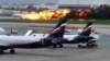 This image taken from video provided by Instagram user @artempetrovich, shows the SSJ-100 aircraft of Aeroflot Airlines on fire during an emergency landing in Sheremetyevo airport in Moscow, Russia, May 5, 2019. 