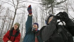 FILE - In this Dec. 19, 2008, file photo, Jeannie Elias, left, Mary Spencer, and Alison Wagner look for birds in Fayston, Vt., for Christmas Bird Count. (AP Photo/Toby Talbot, File)