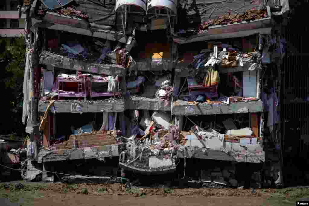 A partly collapsed building is seen after being hit by flash floods that swept through towns in the Turkish Black Sea region in Bozkurt, a town in Kastamonu province, Turkey.