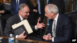 FILE - Senate Foreign Relations Committee Chairman Bob Corker, R-Tenn., right, confers with committee member Sen. Tim Kaine, D-Va., on Capitol Hill in Washington, Jan. 11, 2017.