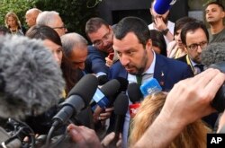 FILE - Italy's Interior Minister Matteo Salvini speaks to the media after a meeting in Innsbruck, Austria, July 11, 2018.