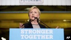 Democratic presidential candidate Hillary Clinton gives a speech on the economy after touring Futuramic Tool & Engineering, in Warren, Mich., Aug. 11, 2016. (AP Photo/Andrew Harnik)