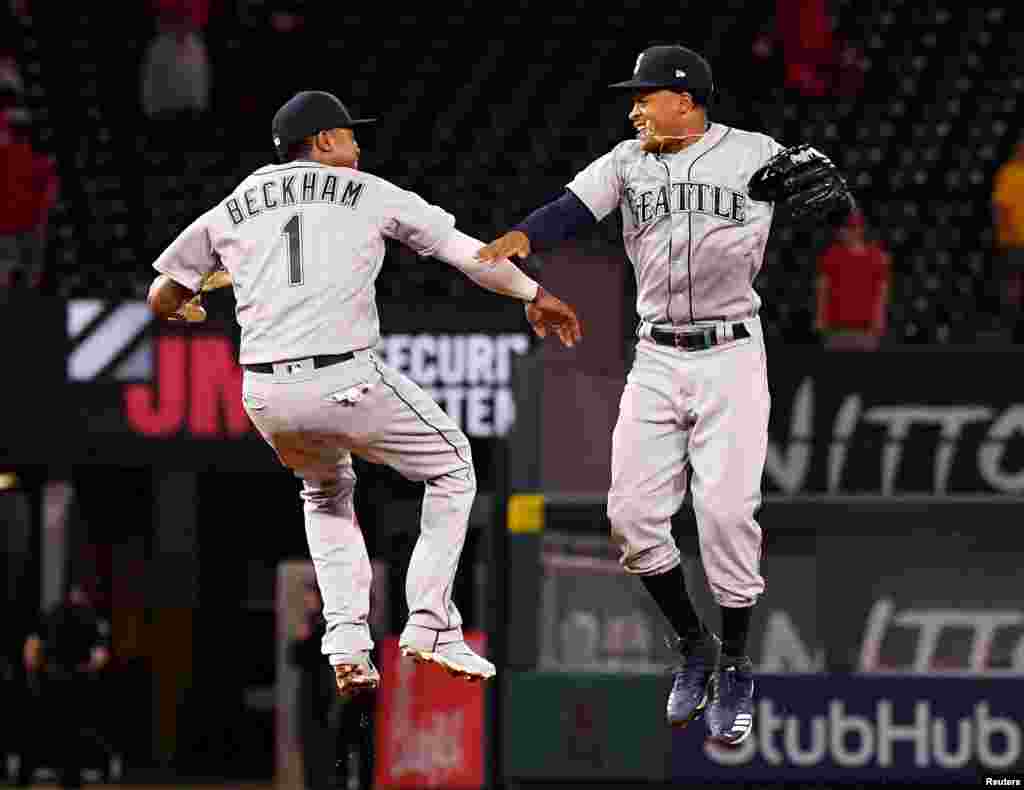 Seattle Mariners shortstop Tim Beckham (1) and center fielder Mallex Smith (0) celebrate after defeating the Los Angeles Angels at Angel Stadium of Anaheim, Apr 18, 2019; Anaheim, CA. (Jayne Kamin-Oncea-USA TODAY Sports)