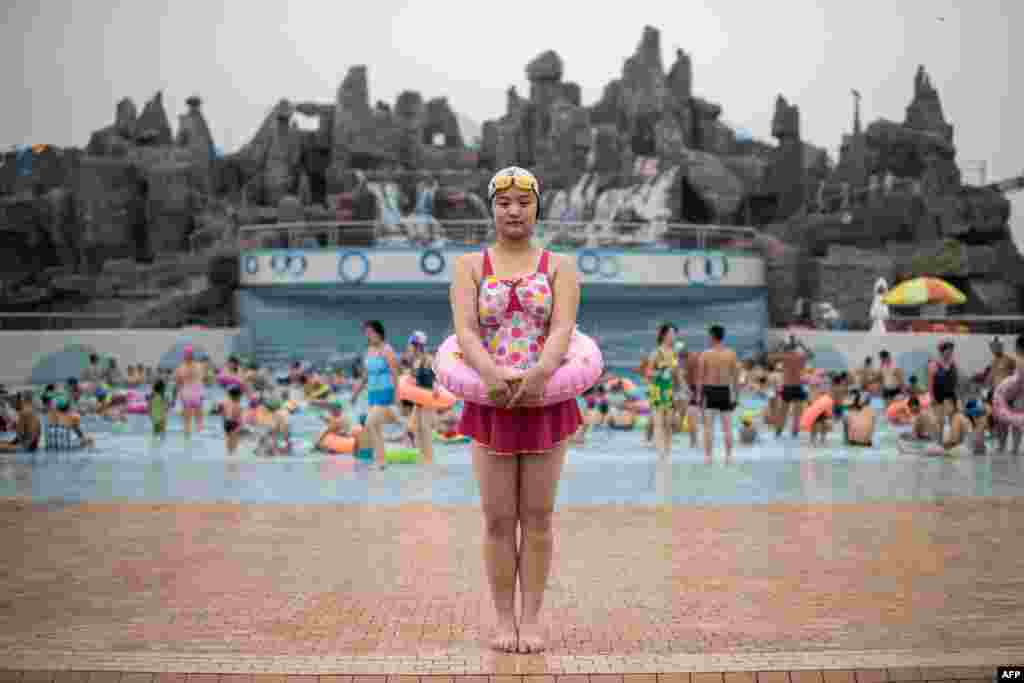 Swimmer Ri Song-Hui (21) poses for a portrait at the Munsu Water Park in Pyongyang.