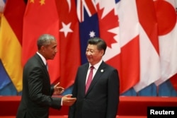FILE - Chinese President Xi Jinping and U.S. President Barack Obama attend the G20 Summit in Hangzhou, Zhejiang province.