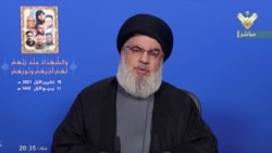 Lebanon's Hezbollah leader Hassan Nasrallah gives a televised speech, in this screengrab taken from Al-Manar TV footage, Lebanon, Oct. 18, 2021.