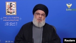 Lebanon's Hezbollah leader Sayyed Hassan Nasrallah gives a televised speech, in this screengrab taken from Al-Manar TV footage, Lebanon October 18, 2021 