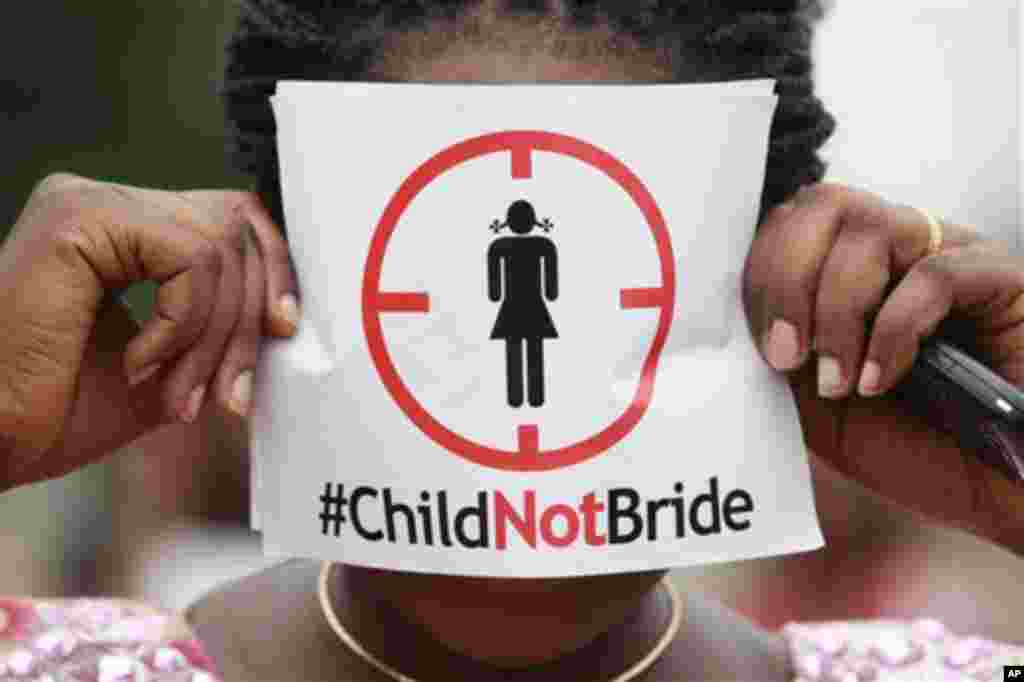 A woman protests against underage marriages in Lagos, July 20, 2013.