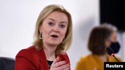 FILE: British Foreign Secretary Liz Truss speaks during a G-7 foreign and development ministers session with guest countries and ASEAN nations in Liverpool, Britain, Dec. 12, 2021.