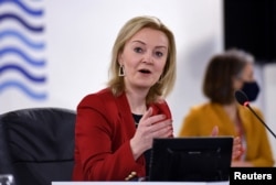 FILE: British Foreign Secretary Liz Truss speaks during a G-7 foreign and development ministers session in Liverpool, Dec. 12, 2021.