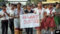 Students of the Convent of Jesus and Mary School protest the gang rape of a nun in her 70s by a group of bandits, which occurred in Ranaghat, northeast of Kolkata in India's West Bengal state, March 14, 2015.