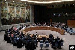 Members of the Security Council vote after presentations for a resolution for an independent investigation on the use of chemical weapons in Syria during a Security Council meeting, April 10, 2018, at United Nations headquarters.