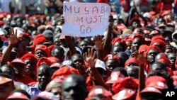 A poster showing opposition to Zimbabwe's President Robert Mugabe is seen at a final Movement For Democratic Change (MDC) campaign rally in Harare, July, 29, 2013. 