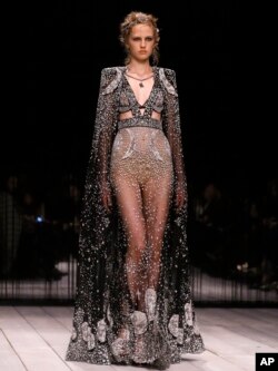 A model displays a design during the Alexander McQueen Autumn/Winter show at London Fashion Week, Feb. 21, 2016.