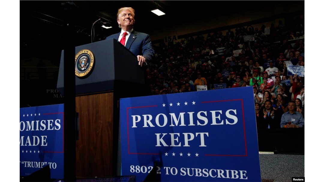 FILE - President Donald Trump holds a rally with supporters at North Side Middle School in Elkhart, Ind., May 10, 2018.
