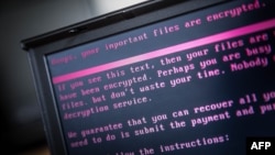 A laptop displays a message after being infected by ransomware as part of a worldwide cyberattack on June 27, 2017 in Geldrop, Netherlands. 